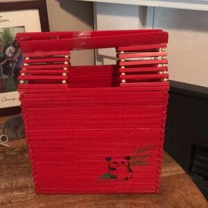 Beautiful  red painted wood handbag with panda design.